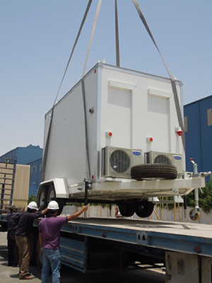 Technicians preparing environmental monitoring equipment